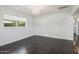 Bedroom featuring dark hardwood floors, chandelier, and neutral paint at 615 E Winter Dr, Phoenix, AZ 85020