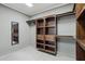 Walk-in closet with ample shelving and hanging storage at 615 E Winter Dr, Phoenix, AZ 85020