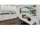 Bright dining area with built-in cabinets, hardwood floors, and a view of the backyard at 615 E Winter Dr, Phoenix, AZ 85020