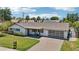 Inviting home with manicured lawn, modern garage door, and quaint front porch at 615 E Winter Dr, Phoenix, AZ 85020