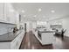 Modern kitchen with white cabinets, stainless steel appliances, and a central island at 615 E Winter Dr, Phoenix, AZ 85020