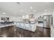 Large kitchen island with bar seating, stainless steel appliances, and modern finishes at 615 E Winter Dr, Phoenix, AZ 85020