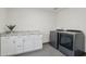 Bright laundry room with granite countertop and modern appliances at 615 E Winter Dr, Phoenix, AZ 85020
