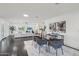 Spacious living room with hardwood floors, adjacent to the dining area, providing a seamless flow at 615 E Winter Dr, Phoenix, AZ 85020