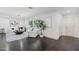 Inviting living room with dark hardwood floors, bright windows, stylish seating, and modern decor at 615 E Winter Dr, Phoenix, AZ 85020