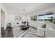 Bright living room with large windows, stylish seating, and modern decor for comfortable living at 615 E Winter Dr, Phoenix, AZ 85020