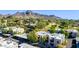 Scenic aerial view showcasing the community's pool, well-maintained grounds, and stunning mountain backdrop at 7300 N Dreamy Draw Dr # 202, Phoenix, AZ 85020