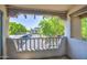Balcony view showcasing the outdoor parking and lush trees offering a serene and private outdoor space at 7300 N Dreamy Draw Dr # 202, Phoenix, AZ 85020