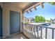 Apartment balcony featuring a secure storage closet and serene community views. A perfect blend of privacy and community living at 7300 N Dreamy Draw Dr # 202, Phoenix, AZ 85020
