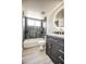 Stylish bathroom featuring updated vanity, round LED mirror, and tiled shower-tub combo at 7300 N Dreamy Draw Dr # 202, Phoenix, AZ 85020
