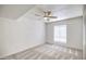 An empty bedroom with a ceiling fan and a large window, ideal for personalization at 7300 N Dreamy Draw Dr # 202, Phoenix, AZ 85020