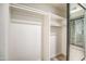 A closet with a mirror sliding door, shelving, and multiple hanging rods for optimal storage at 7300 N Dreamy Draw Dr # 202, Phoenix, AZ 85020
