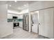 Kitchen featuring stainless steel appliances and a laundry closet in the hallway at 7300 N Dreamy Draw Dr # 202, Phoenix, AZ 85020
