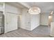 Open-concept living area features wood-look floors with access to kitchen and dining area at 7300 N Dreamy Draw Dr # 202, Phoenix, AZ 85020