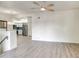 Open living room with views of kitchen featuring modern fixtures and wood-look flooring at 7300 N Dreamy Draw Dr # 202, Phoenix, AZ 85020