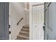 Inviting staircase with neutral tones and a minimalist design featuring a modern banister and natural light at 7300 N Dreamy Draw Dr # 202, Phoenix, AZ 85020