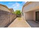 Backyard featuring brick-lined patio and graveled landscaping at 817 E Lamonte St, San Tan Valley, AZ 85140