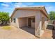 Back view of the patio with brick pillars and gravel landscaping at 817 E Lamonte St, San Tan Valley, AZ 85140