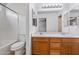 Bathroom showing double sink vanity, toilet and combination shower and tub at 817 E Lamonte St, San Tan Valley, AZ 85140