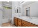 Bathroom showing double sink vanity, toilet and combination shower and tub at 817 E Lamonte St, San Tan Valley, AZ 85140
