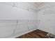 A walk-in closet with white shelving to maximize storage potential at 817 E Lamonte St, San Tan Valley, AZ 85140