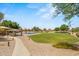 Well-maintained community park featuring a playground, picnic area, and green spaces at 817 E Lamonte St, San Tan Valley, AZ 85140