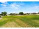 Scenic neighborhood park with a lush green lawn, perfect for recreation and relaxation at 817 E Lamonte St, San Tan Valley, AZ 85140