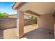 Covered patio featuring concrete floors and brick privacy walls at 817 E Lamonte St, San Tan Valley, AZ 85140