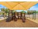 Community playground featuring slides, ladders, and soft wood chip ground cover at 817 E Lamonte St, San Tan Valley, AZ 85140