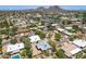 Wide aerial shot of a desert community, highlighting the homes and surrounding mountain vistas at 851 E Village Circle N Dr, Phoenix, AZ 85022