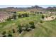 Aerial view of golf course and desert landscape, a picturesque blend of recreation and natural beauty at 851 E Village Circle N Dr, Phoenix, AZ 85022