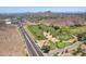 High-angle view of a golf course with lush green fairways next to a well-traveled road at 851 E Village Circle N Dr, Phoenix, AZ 85022