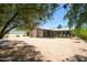 Home backyard has string lights, desert landscaping, and covered patio at 851 E Village Circle N Dr, Phoenix, AZ 85022