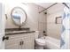 Updated bathroom features modern vanity with dark granite counter and bathtub with decorative tile surround at 851 E Village Circle N Dr, Phoenix, AZ 85022