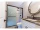 Bathroom features tile shower with glass door, and modern vanity with granite counter at 851 E Village Circle N Dr, Phoenix, AZ 85022