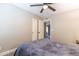 Neutral toned bedroom features a ceiling fan and view through to next room at 851 E Village Circle N Dr, Phoenix, AZ 85022