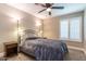 Bedroom featuring neutral carpet, ceiling fan and two side tables at 851 E Village Circle N Dr, Phoenix, AZ 85022