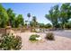 Welcome to The Villages Casas! A lovely gated community entrance with mature landscaping at 851 E Village Circle N Dr, Phoenix, AZ 85022