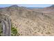 High-altitude view of arid land alongside a desert highway near rugged, mountainous terrain at 851 E Village Circle N Dr, Phoenix, AZ 85022