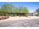 Charming single-story home with mature landscaping and a two-car garage at 851 E Village Circle N Dr, Phoenix, AZ 85022