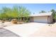 A single-story home featuring drought-resistant landscaping, a walkway, and two car garage at 851 E Village Circle N Dr, Phoenix, AZ 85022