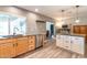 Spacious kitchen with stainless steel appliances, wood-look tile flooring, and ample counter space at 851 E Village Circle N Dr, Phoenix, AZ 85022