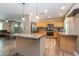 Bright kitchen with granite countertops, stainless steel appliances, and a center island at 851 E Village Circle N Dr, Phoenix, AZ 85022