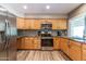 Updated kitchen featuring stainless steel appliances and wood-look tile flooring at 851 E Village Circle N Dr, Phoenix, AZ 85022