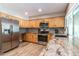 Well-lit kitchen featuring stainless steel appliances and granite countertops at 851 E Village Circle N Dr, Phoenix, AZ 85022
