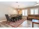 An open-concept living space featuring wood-look tile flooring and lots of natural light at 851 E Village Circle N Dr, Phoenix, AZ 85022