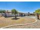 Large backyard with patio, pool, mature trees, and a mix of grass and gravel landscaping at 856 N Evergreen St, Chandler, AZ 85225