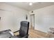 Well-lit bedroom featuring a black office chair, and wood floors at 856 N Evergreen St, Chandler, AZ 85225