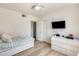 This bedroom has a ceiling fan, closet, and a mounted television at 856 N Evergreen St, Chandler, AZ 85225