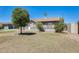 Charming house featuring mature trees, a manicured lawn, and a cozy front porch at 856 N Evergreen St, Chandler, AZ 85225